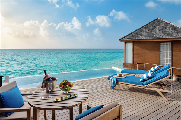 Anantara Dhigu Maldives Resort - Guest Room Deluxe Sunset Over Water Pool Villa Deck with Loungers.jpg