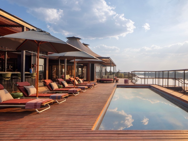 1785944051.jpg Anantara Tented Camp Kafue River Public Main Pool Wide Evening.jpg